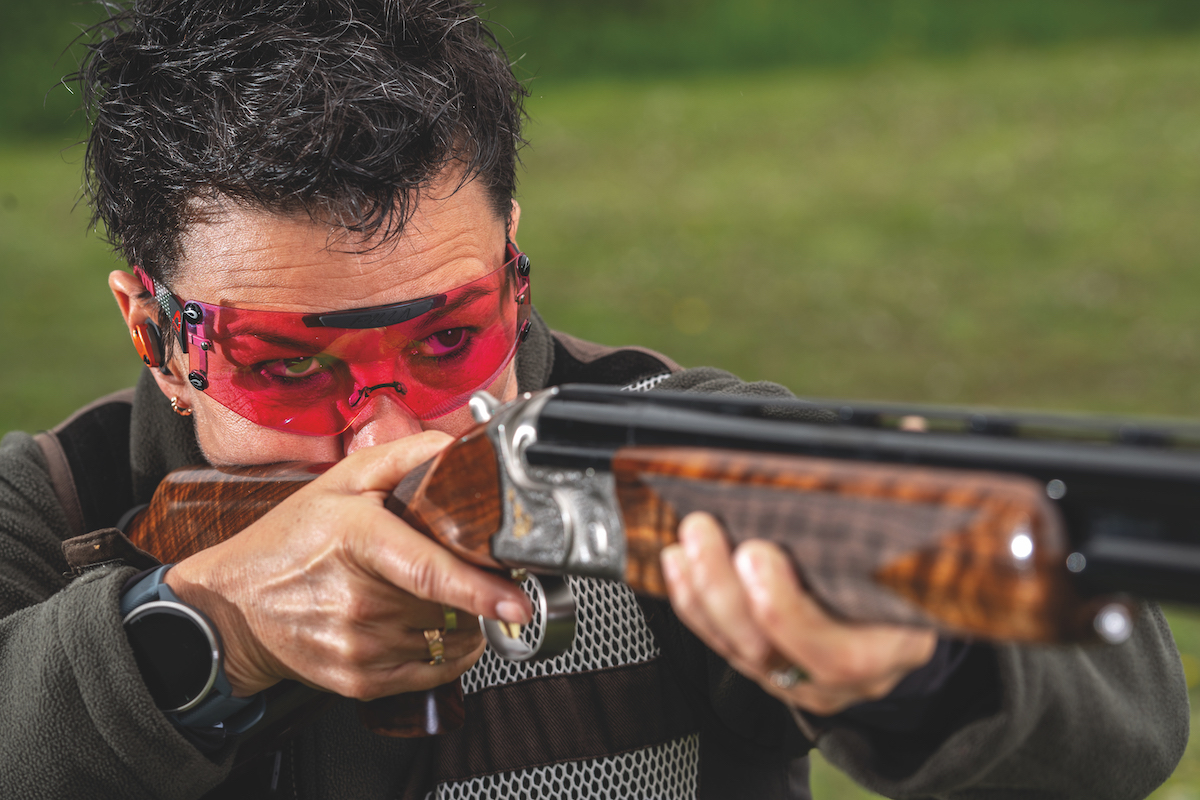 woman shooting shotgun